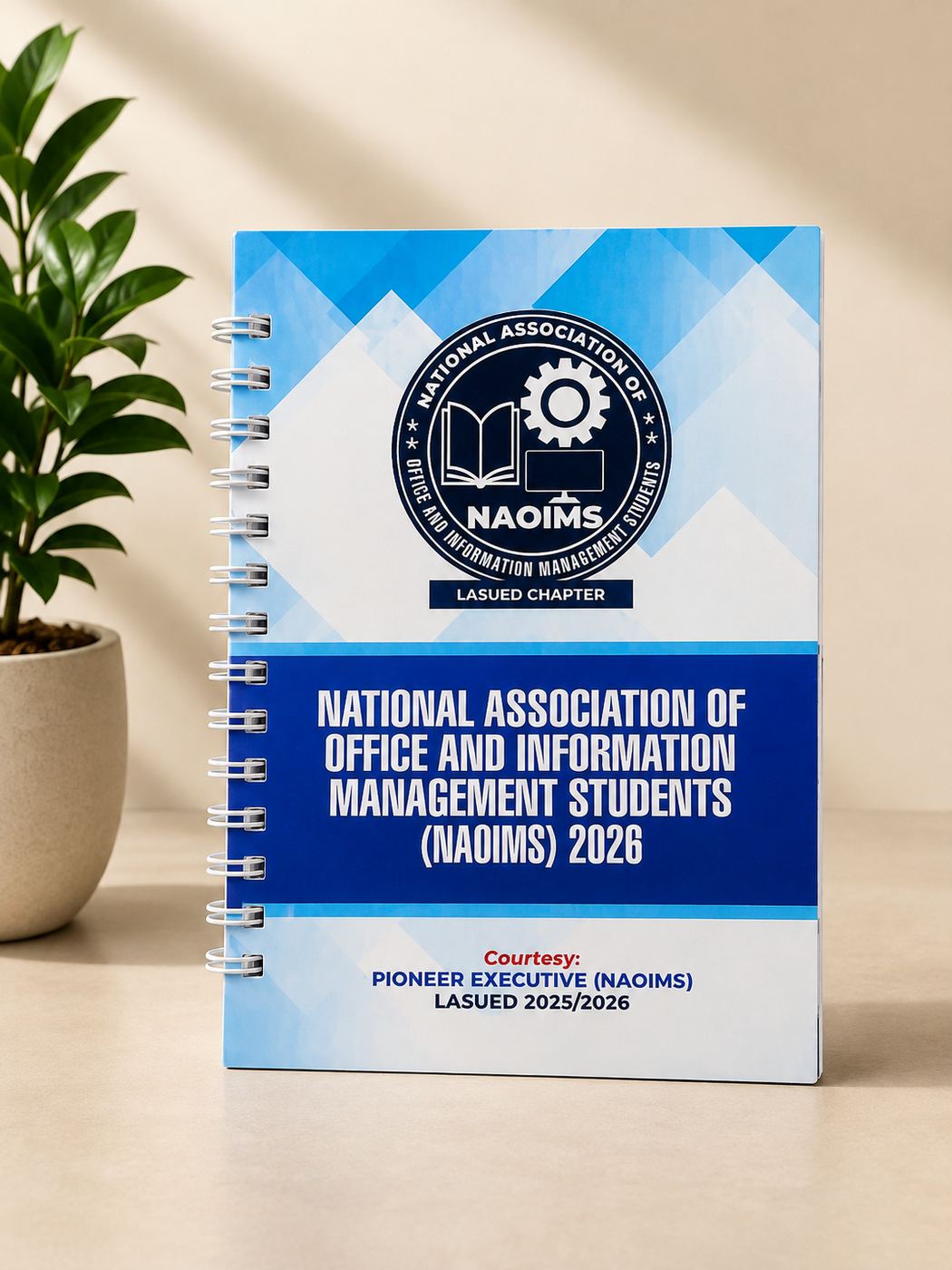 A wire-bound notebook printed for the NAOIMS student association, LASUED chapter